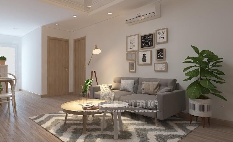 Sofa văng bọc nỉ màu ghi đơn giản và nhỏ xinh được thiết kế để phù hợp với phòng khách chung cư.